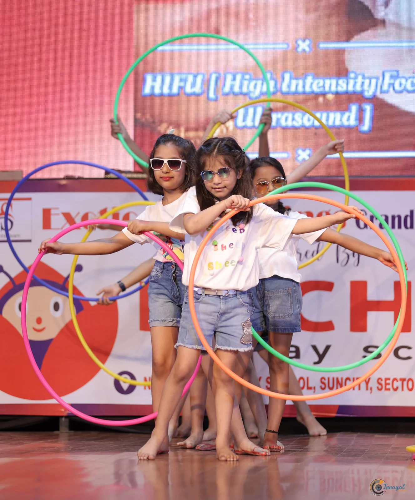 Students performing with colourful hula hoops